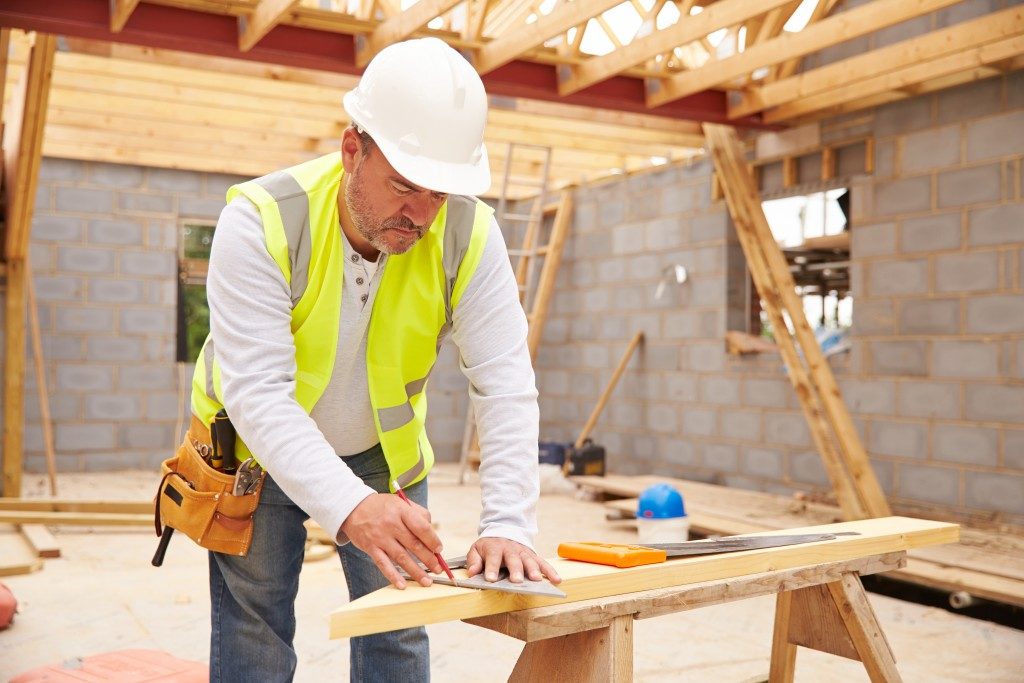 A design engineer working with wood